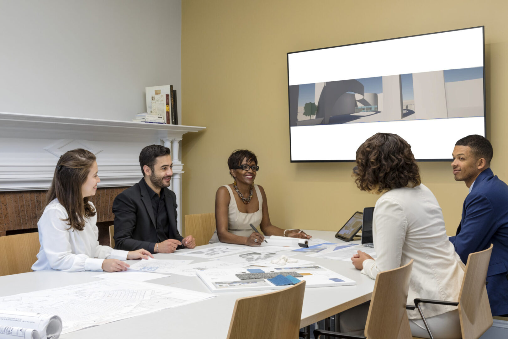 A group of people sitting around a table.